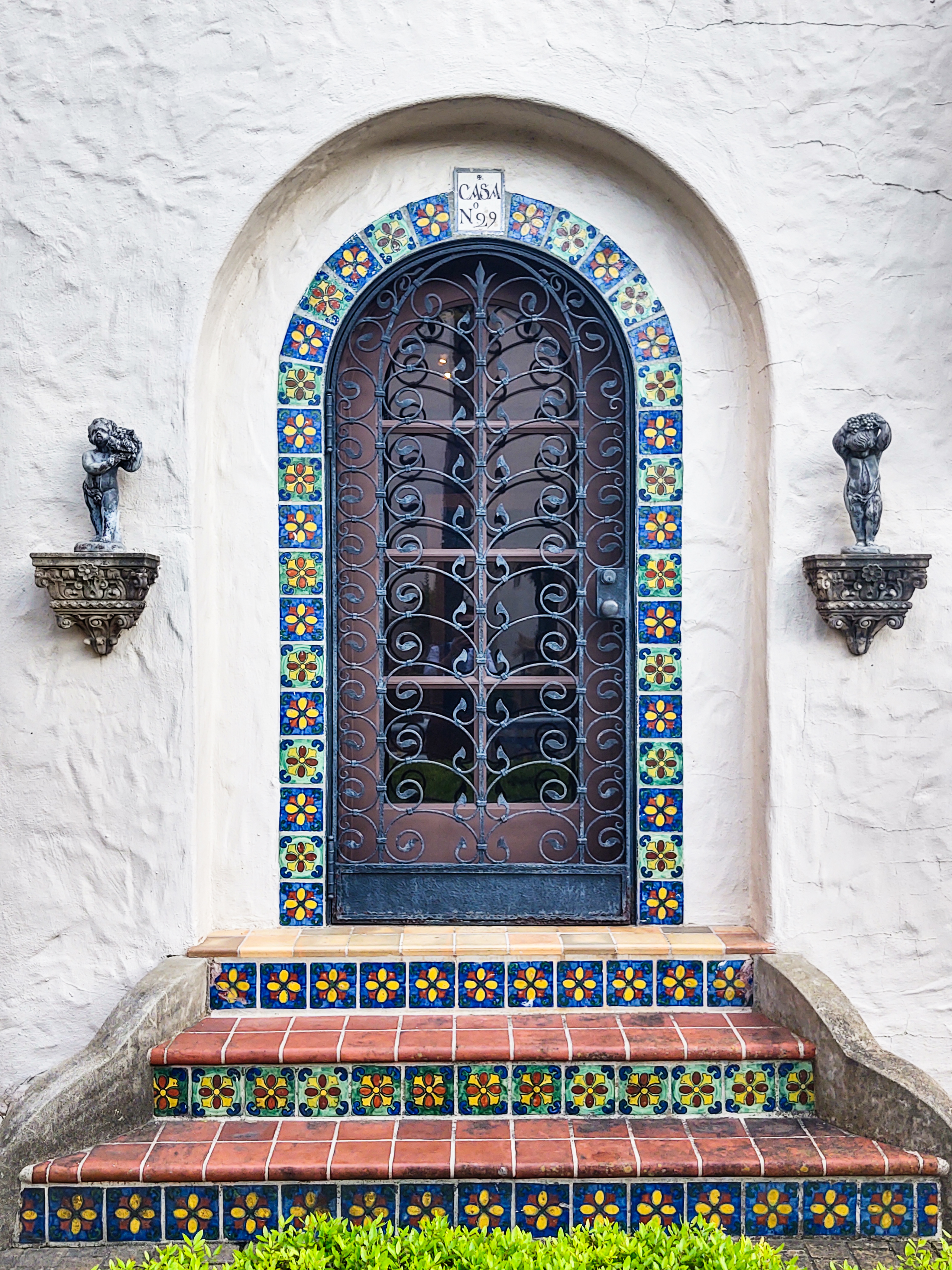 Ornate doorway and steps with local native tile accents