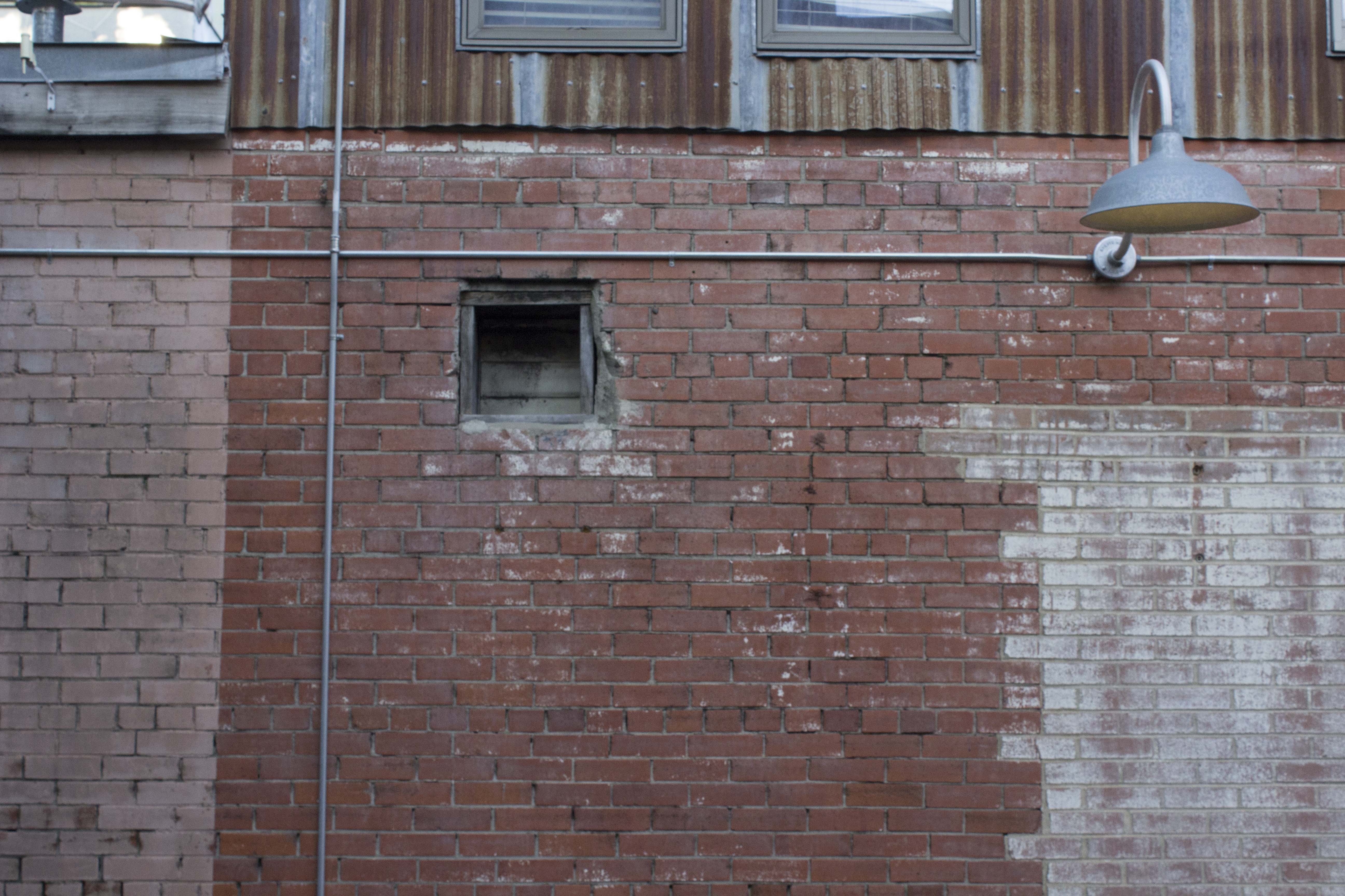 Interesting wear on brick wall