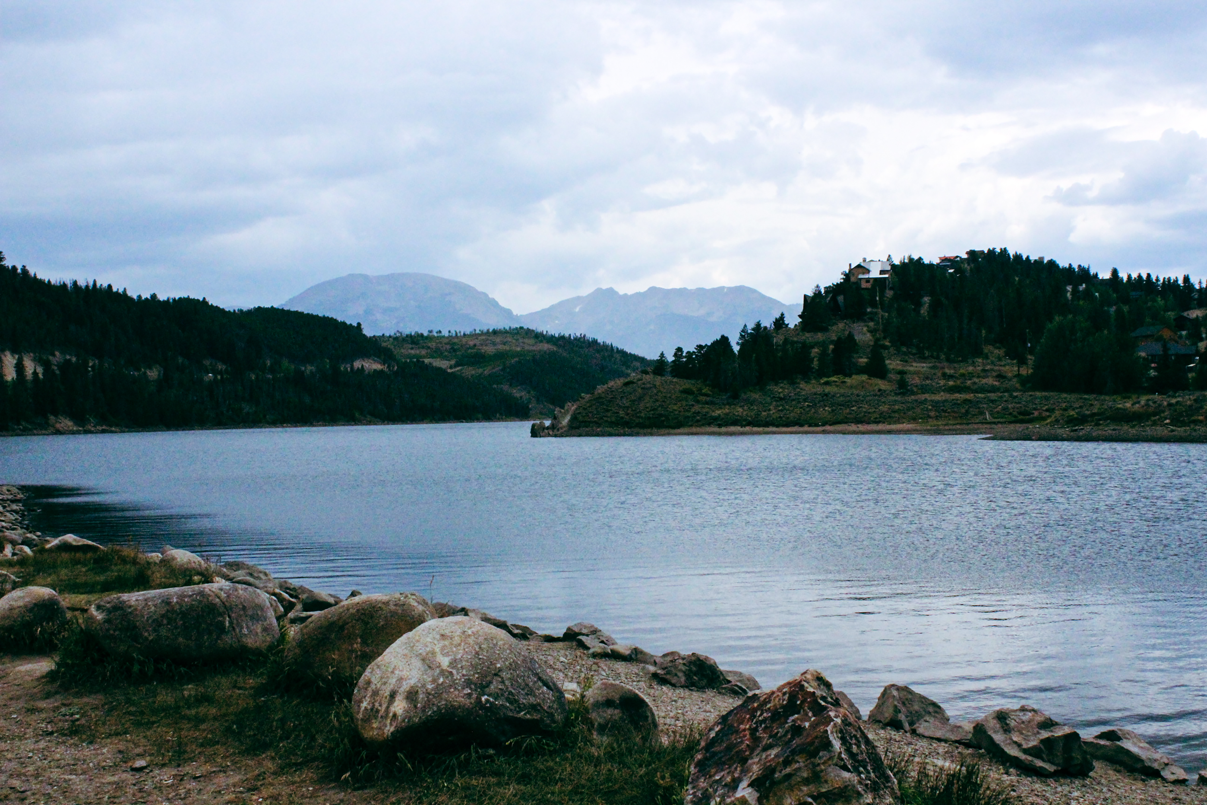 Lake side view with mountains in the background